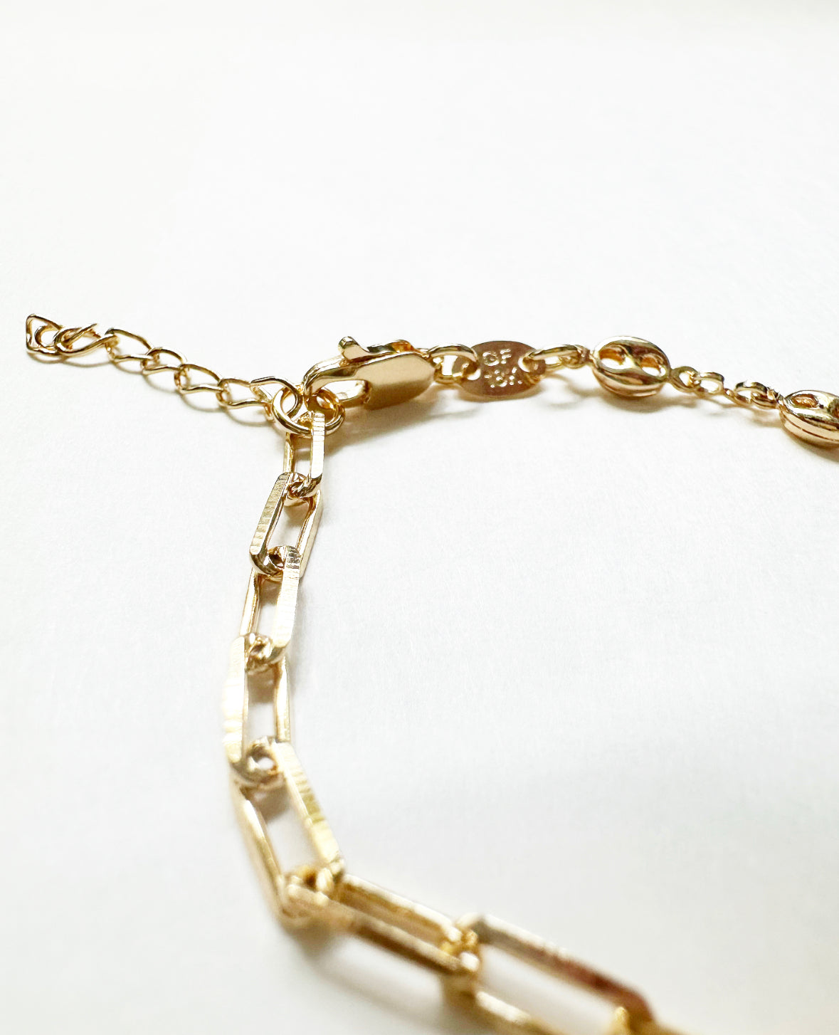 Close-up view of the lobster clasp and extender on our Glow Bracelet.
