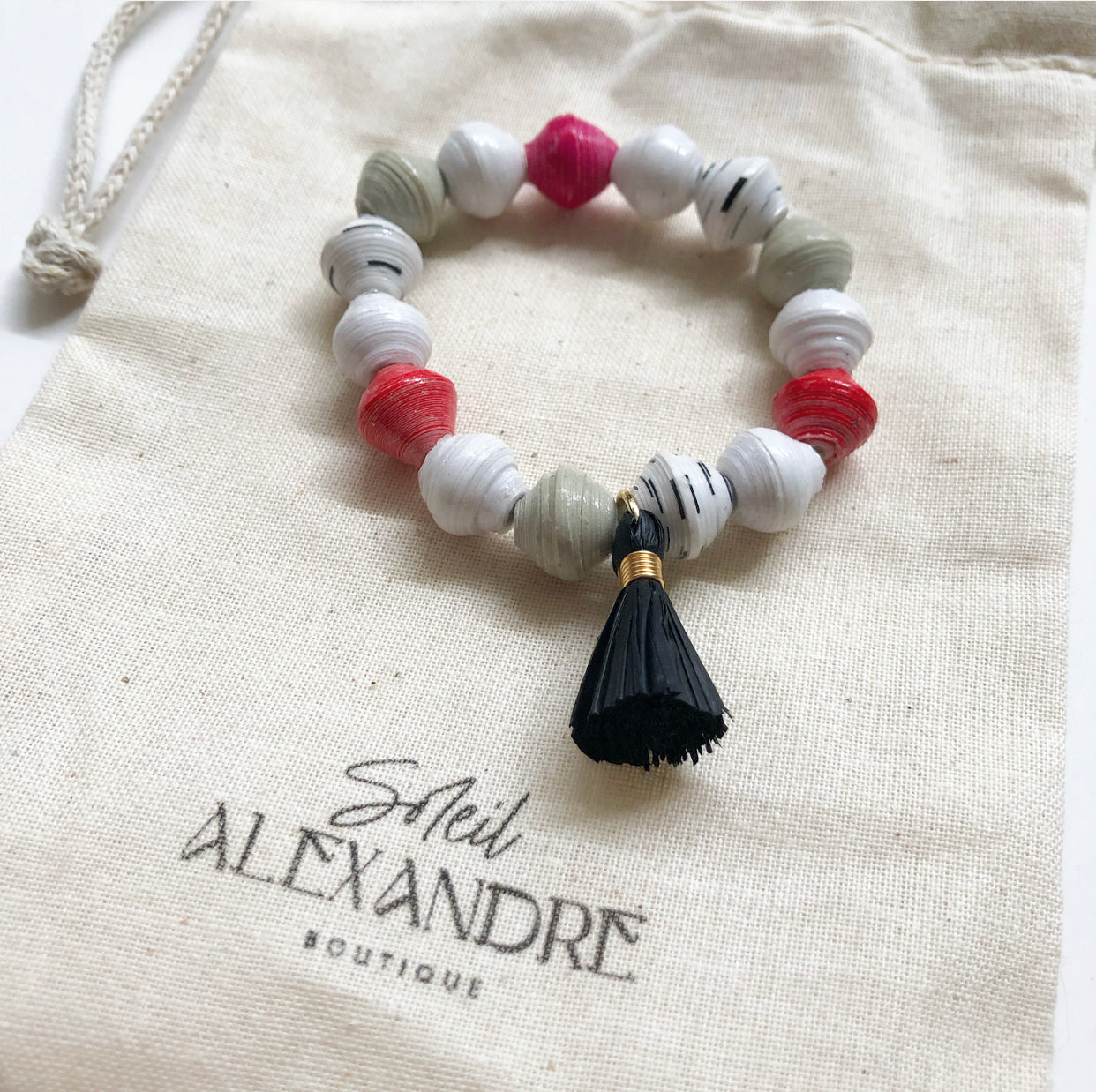 Strawberry Truffle Beaded Bracelet styled on our drawstring jewelry bag.