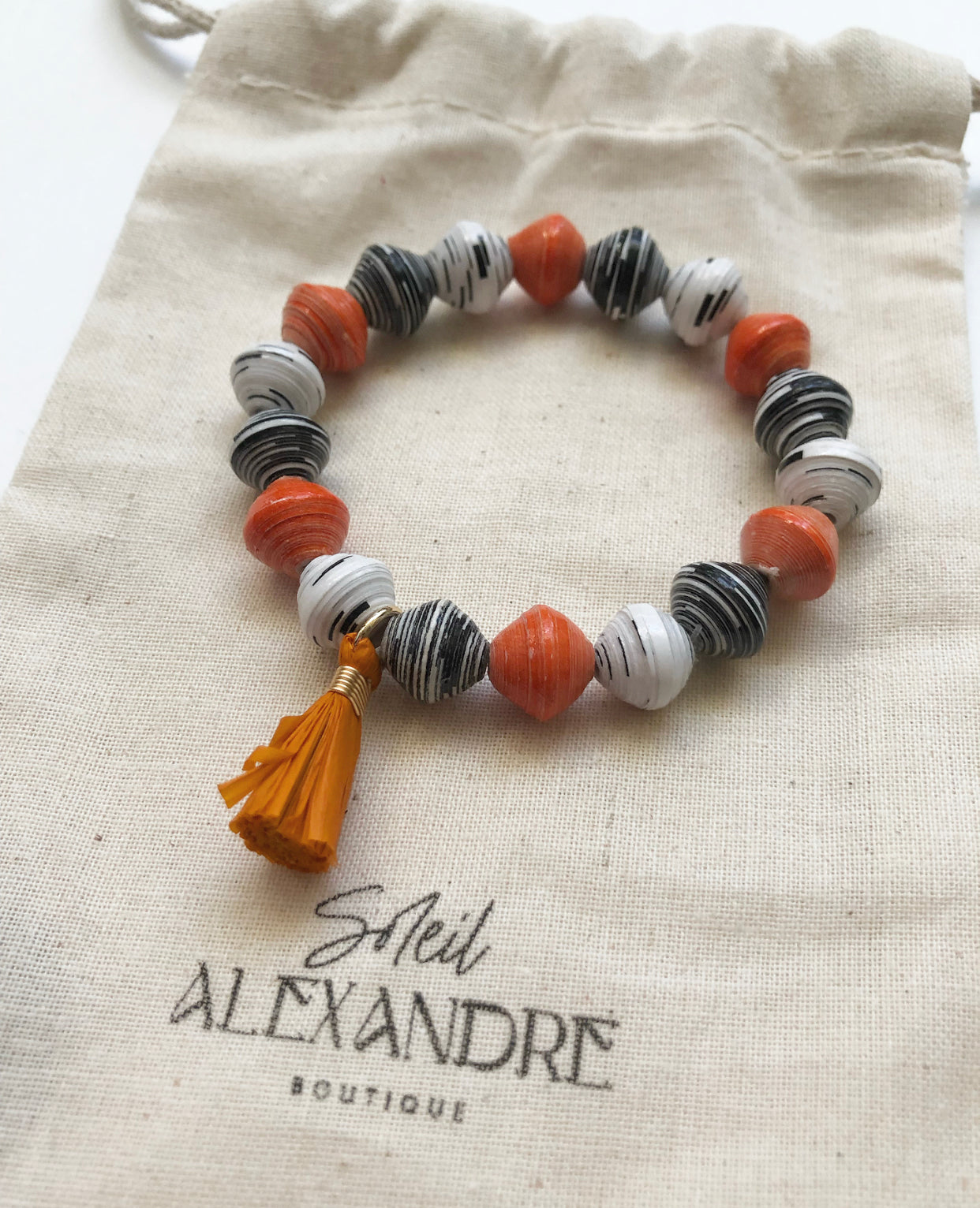 Pumpkin Spice Beaded Bracelet styled on our drawstring jewelry bag.