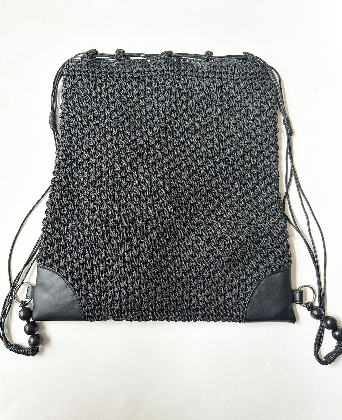 Flattened Nite & Day Drawstring Bag in Black.