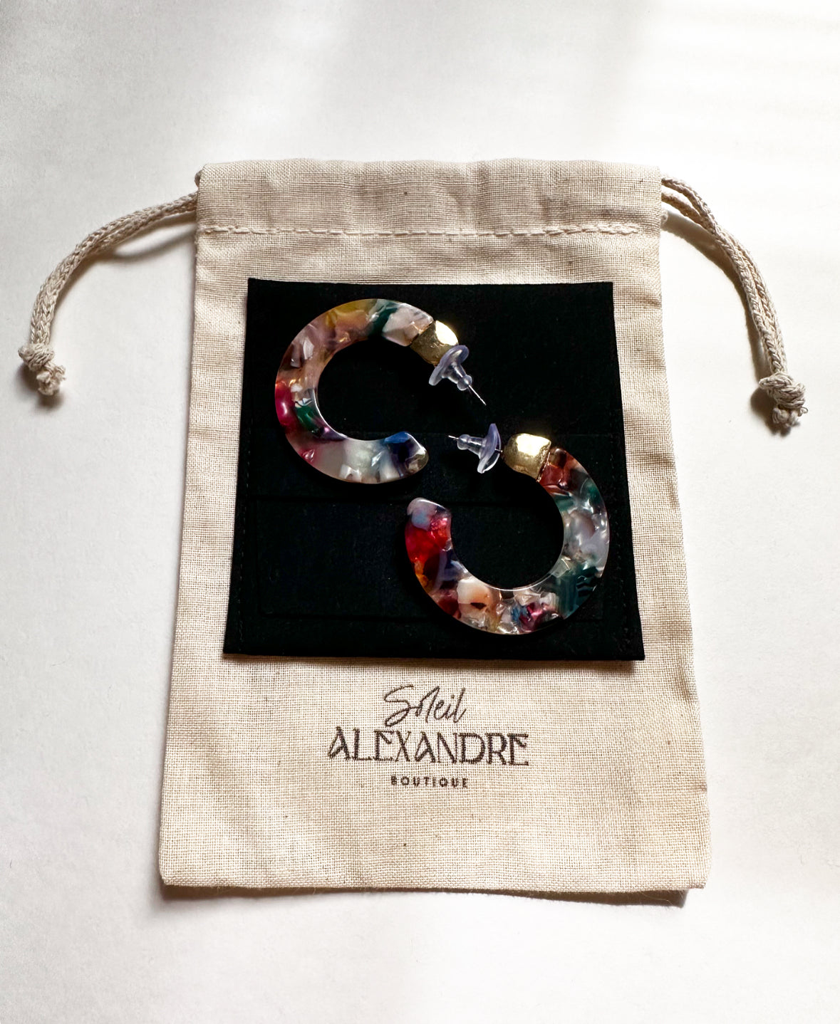 Tropicana Pink Leilani Hoops on our drawstring bag with logo.