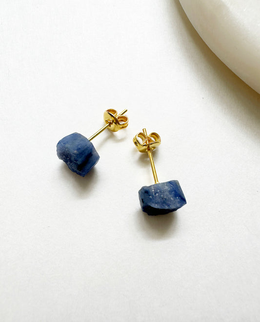 Raw sapphire birthstone stud earrings with 14k gold post.
