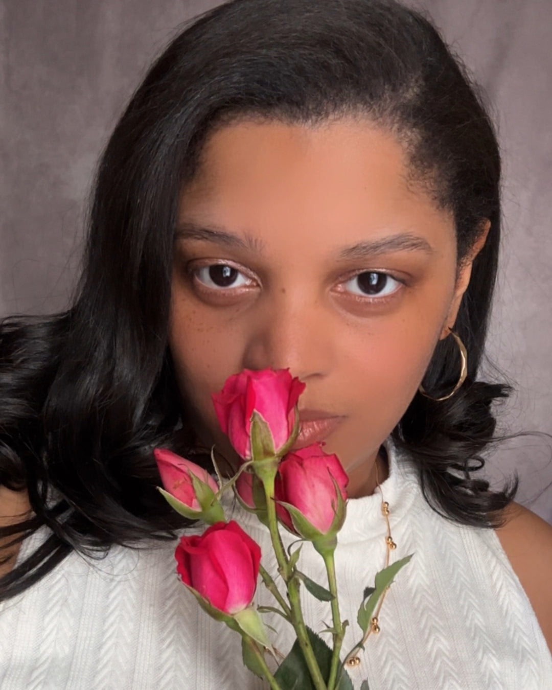 Vada Hoops modeled on earlobes.