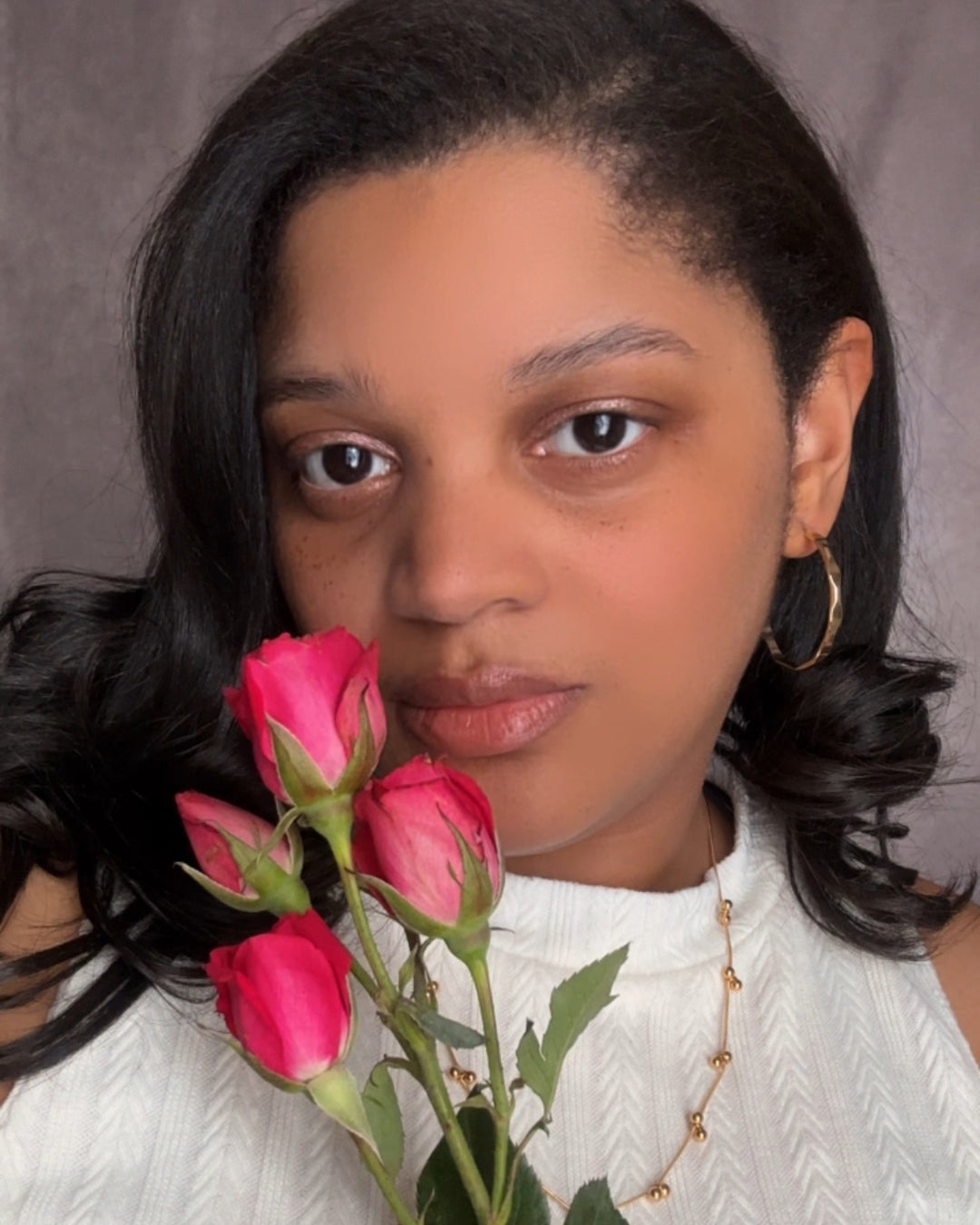 Vada Hoops modeled on earlobes.