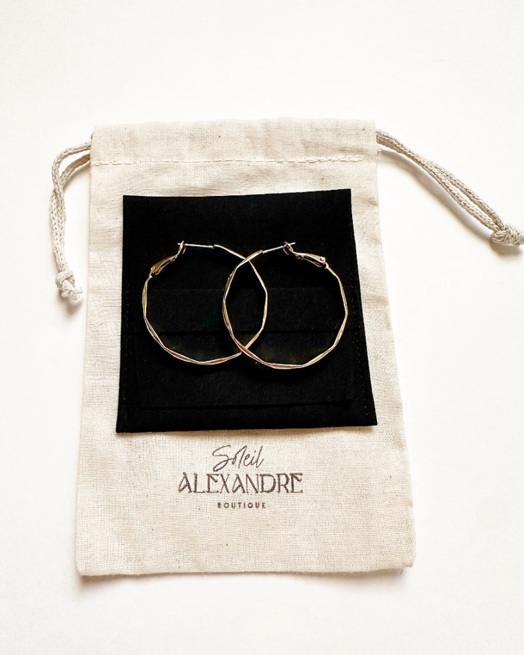 Vada Hoops styled on our drawstring jewelry bag.