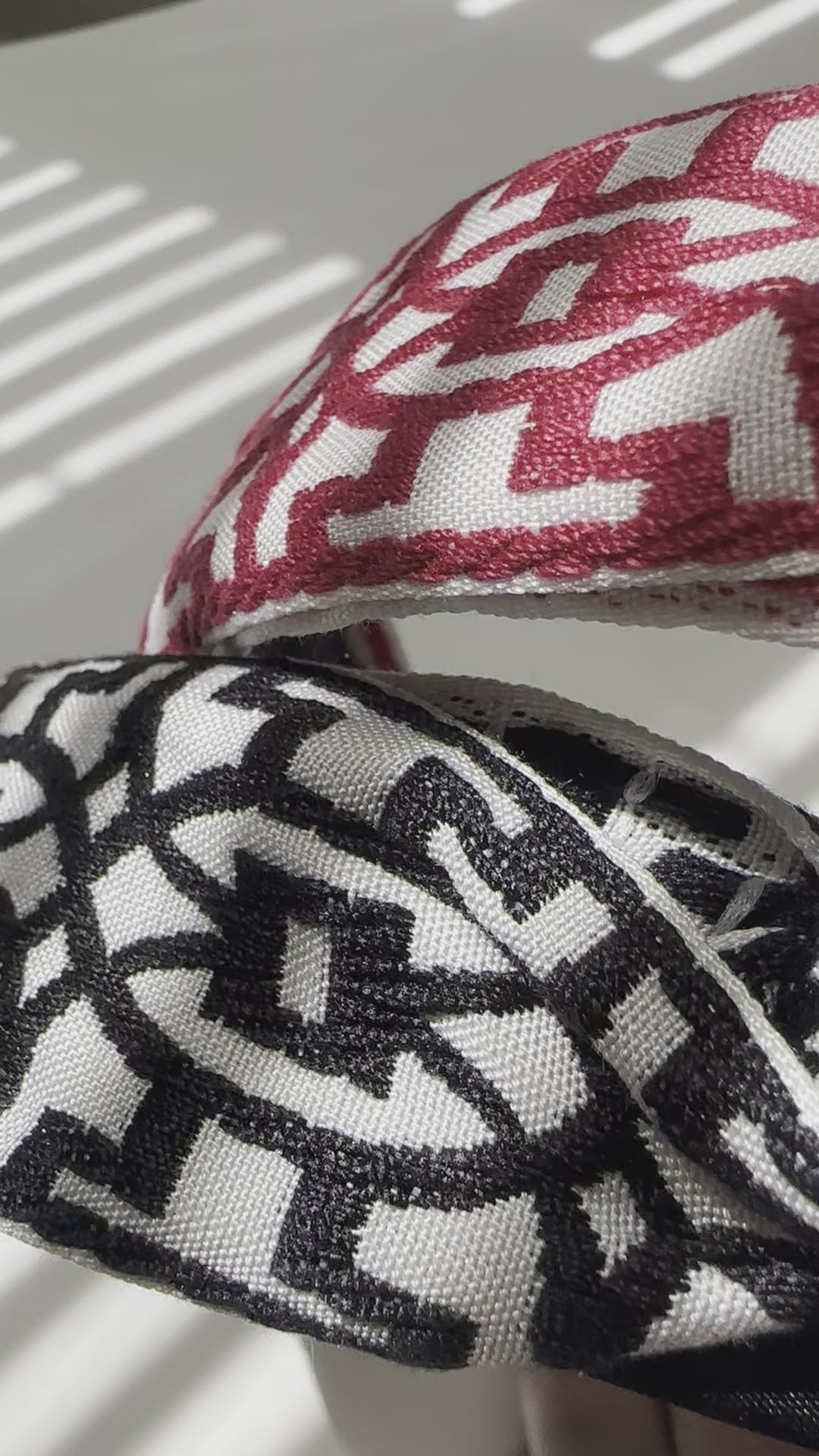 A real-time close-up view of the embroidery detailing on the headband.