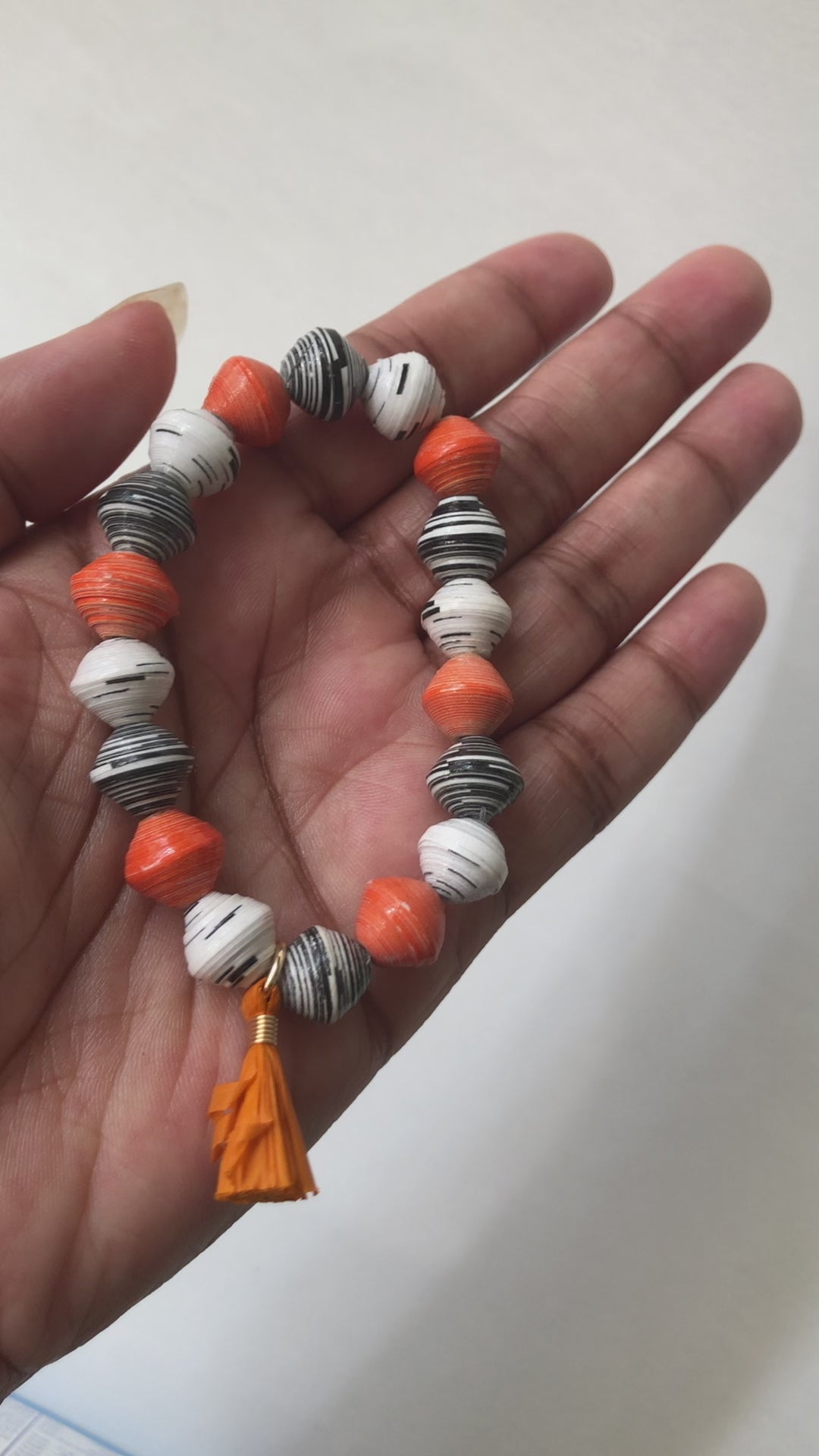 A real-time view of our Pumpkin Spice Bracelet shown on the palm of our model’s hand.