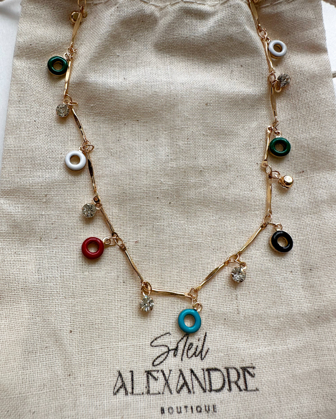 Confection Choker Necklace styled on our drawstring jewelry bag.