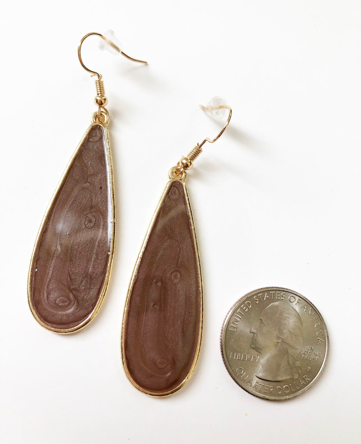 Taupe Candy Rain Drop Earrings next to a quarter for size comparison.