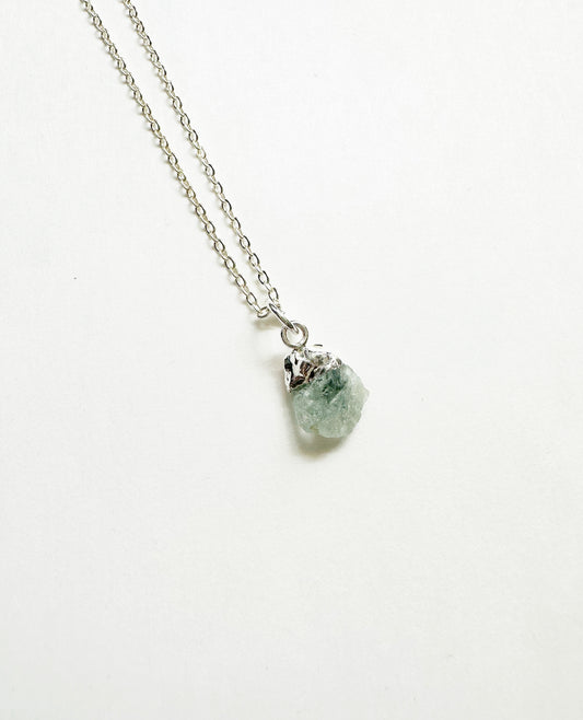 Photo of raw aquamarine birthstone necklace.