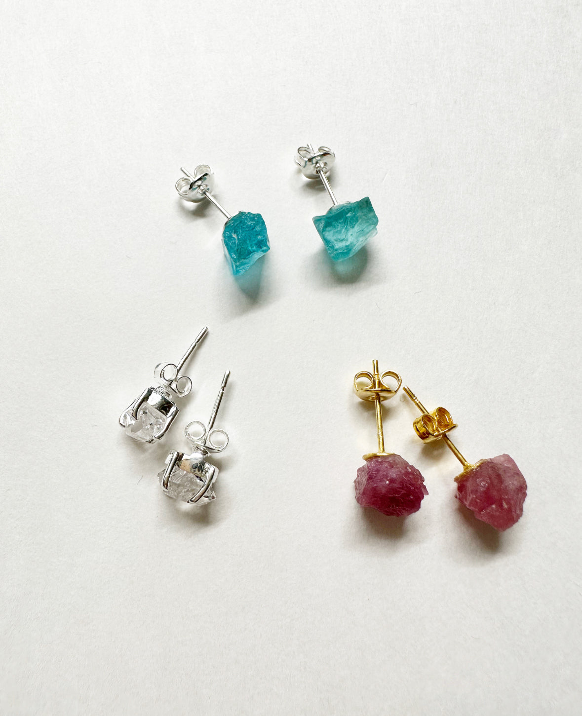 Photo of aquamarine, Herkimer diamond, and pink tourmaline stud earrings