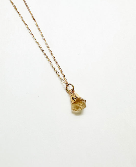 Photo of raw citrine birthstone necklace.