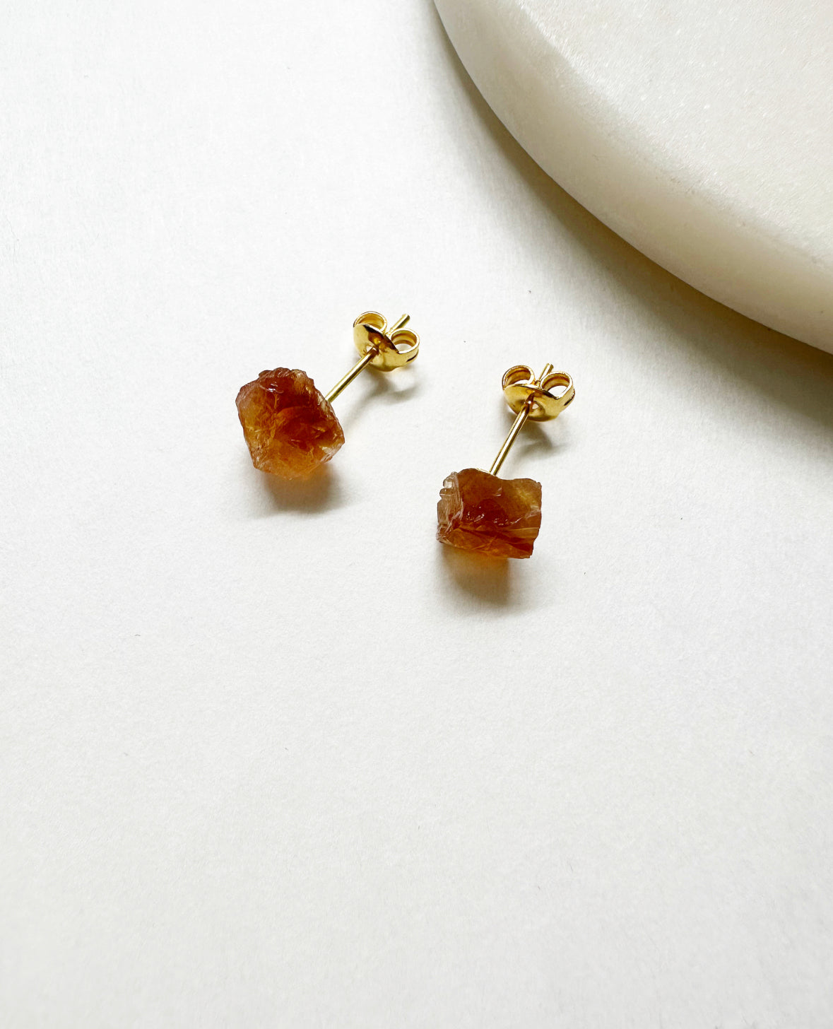 Raw citrine birthstone stud earrings with 14k gold post.