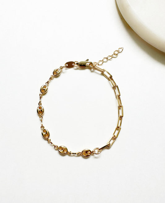 Full view of our Glow Bracelet featuring half paperclip chain and half mariner puff chain with a lobster closure.