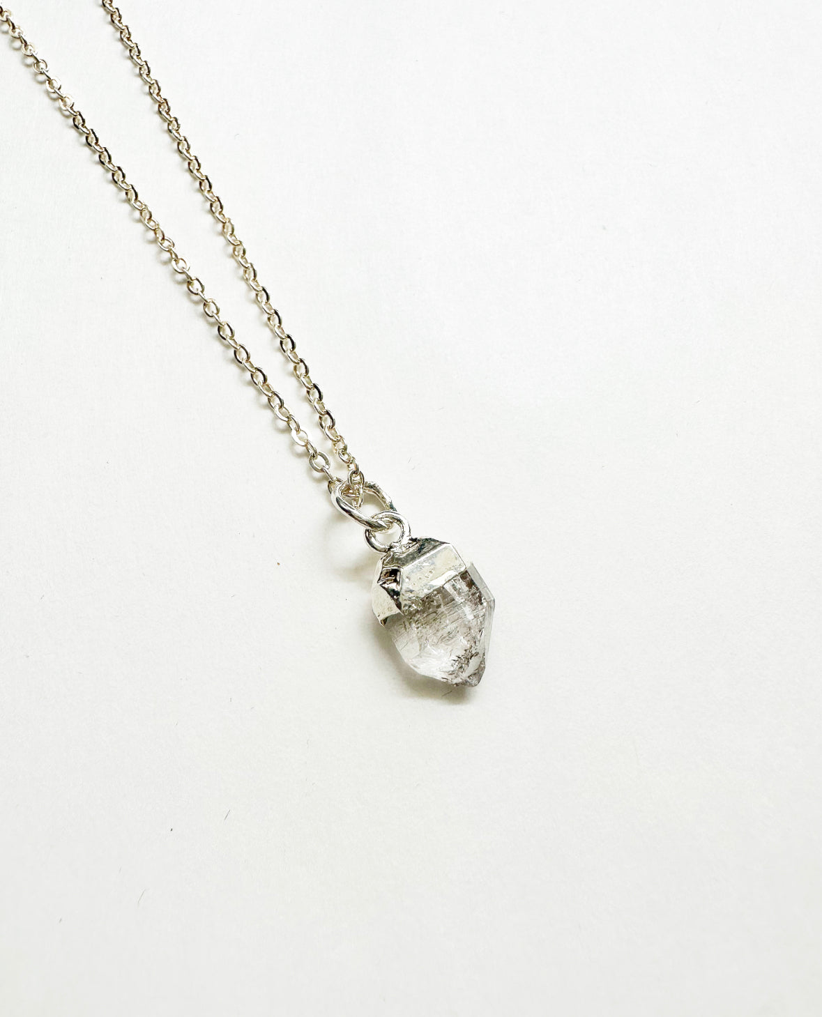 Photo of raw herkimer diamond birthstone necklace.