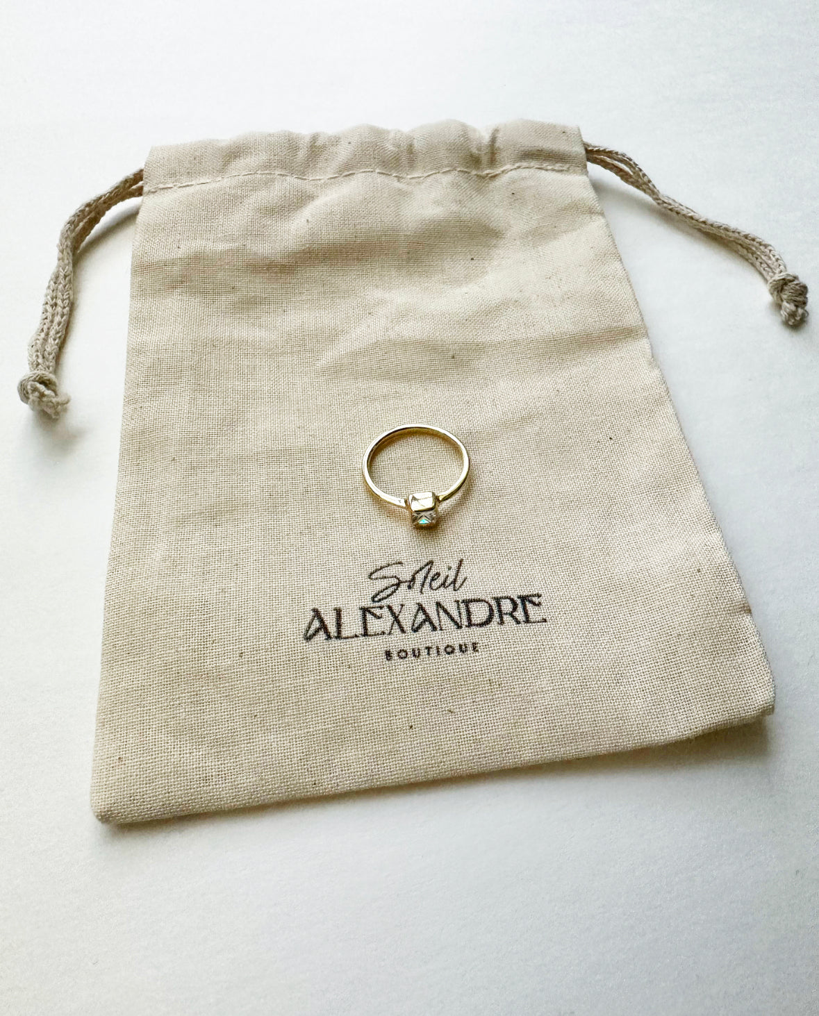 Angel of Mine Ring styled on our drawstring jewelry bag.