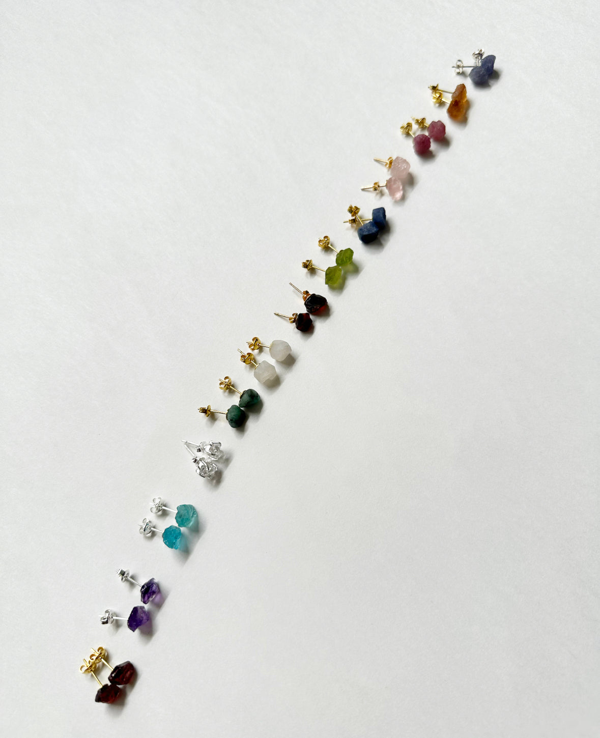 Photo of all raw gemstone birthstone stud earrings.
