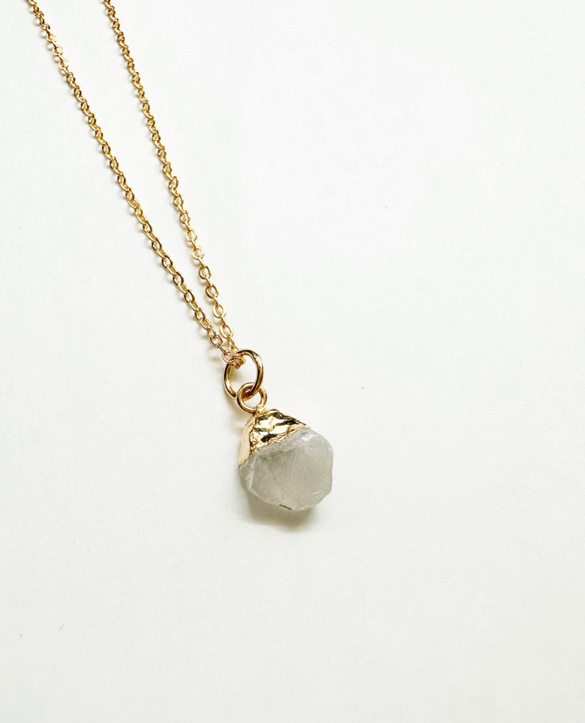 Photo of raw moonstone birthstone necklace.