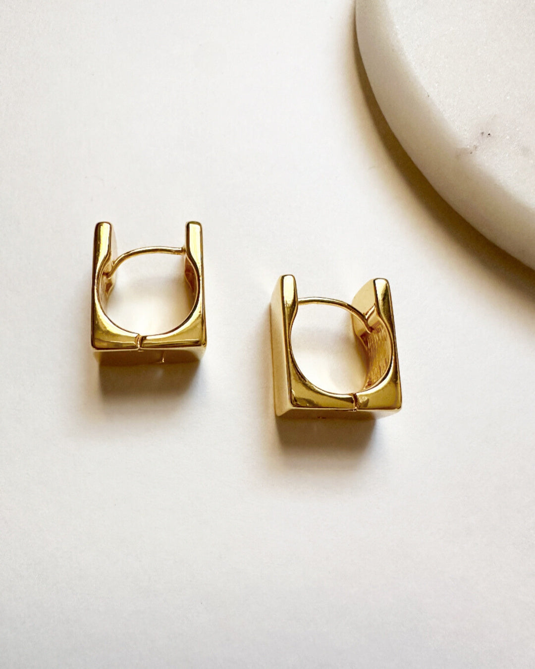 Our gold-toned square-shaped Noa Hoops.