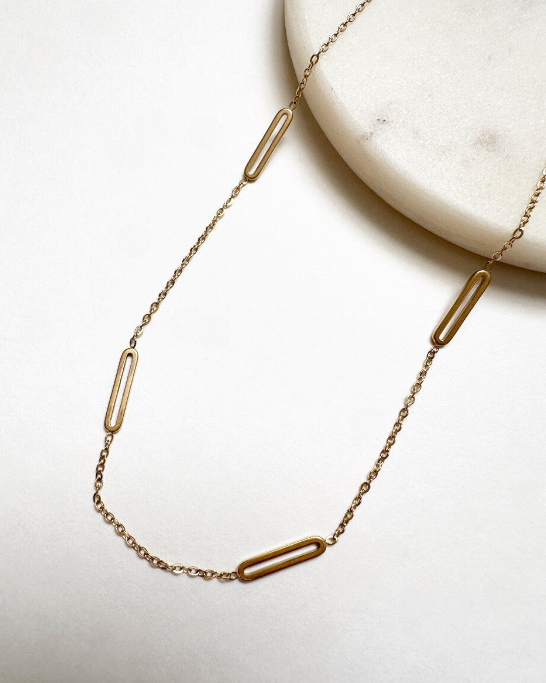 Close-up view of our gold Paloma Necklace.