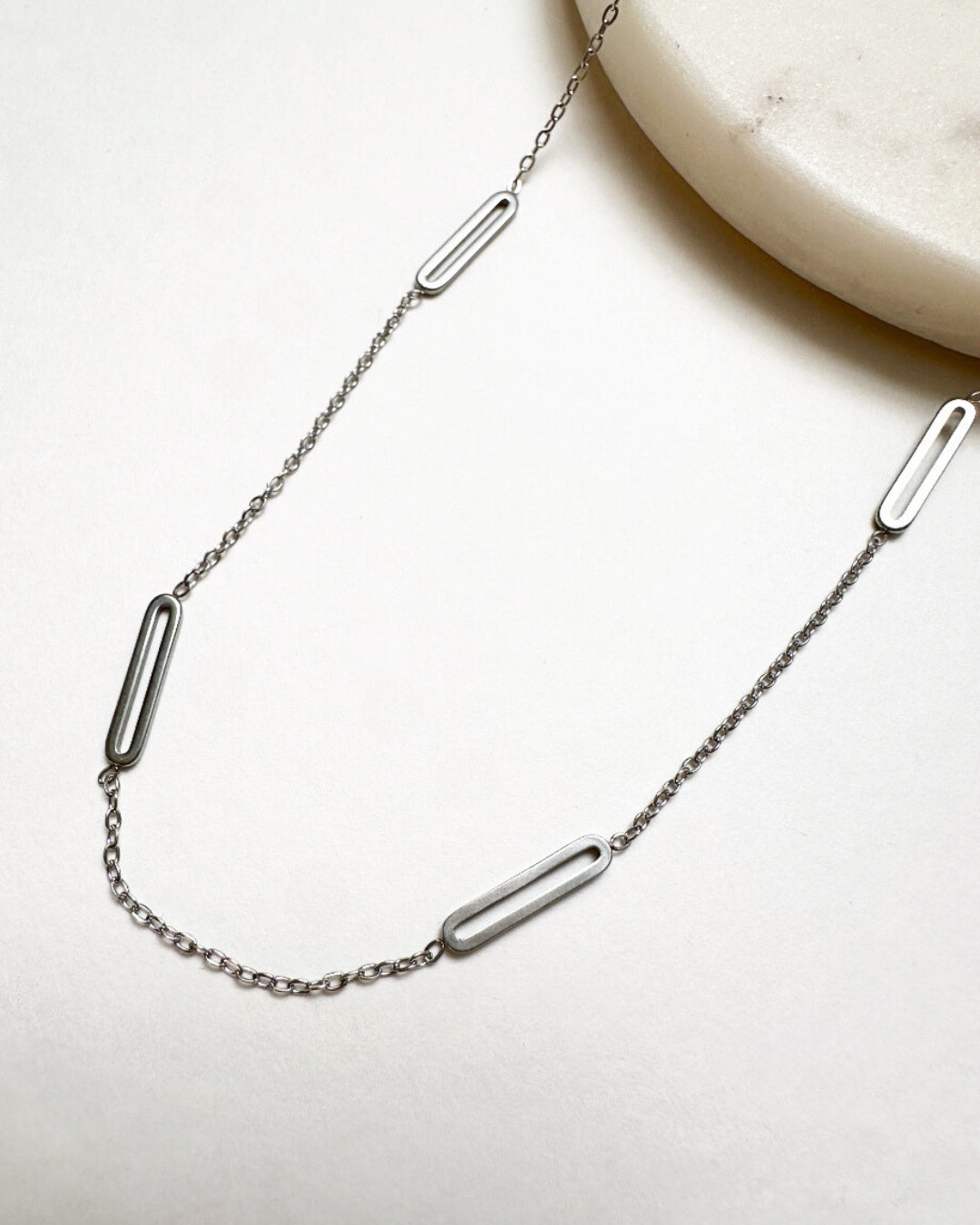 Close-up view of our silver Paloma Necklace.