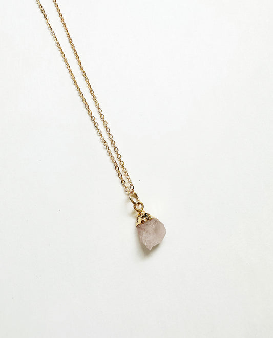 Photo of raw rose quartz birthstone necklace.