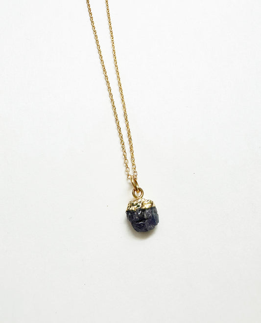 Photo of raw sapphire birthstone necklace.