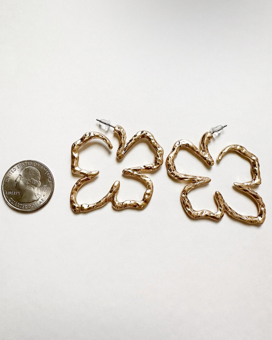 Xochitl Earrings shown next to a quarter for size comparison.