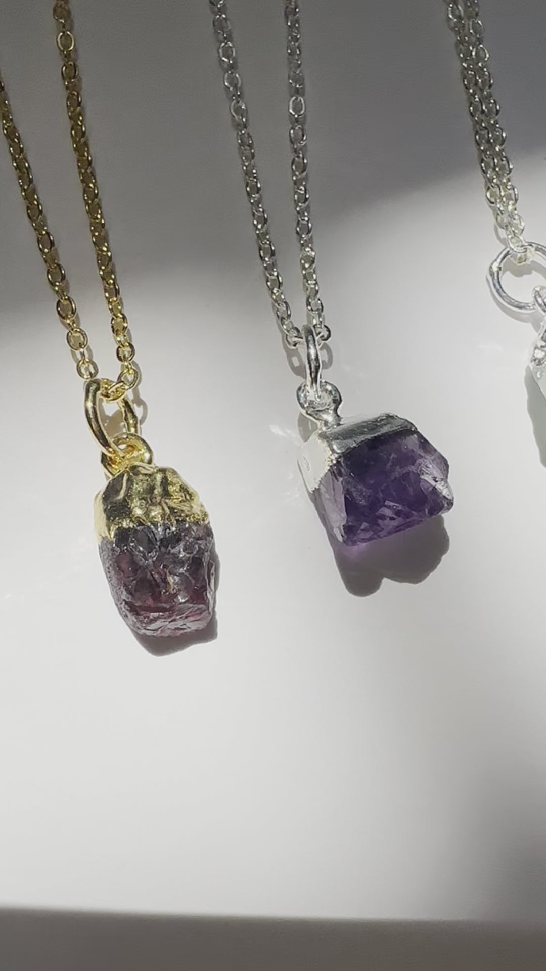 A real-time view of all twelve raw gemstone birthstone necklaces.