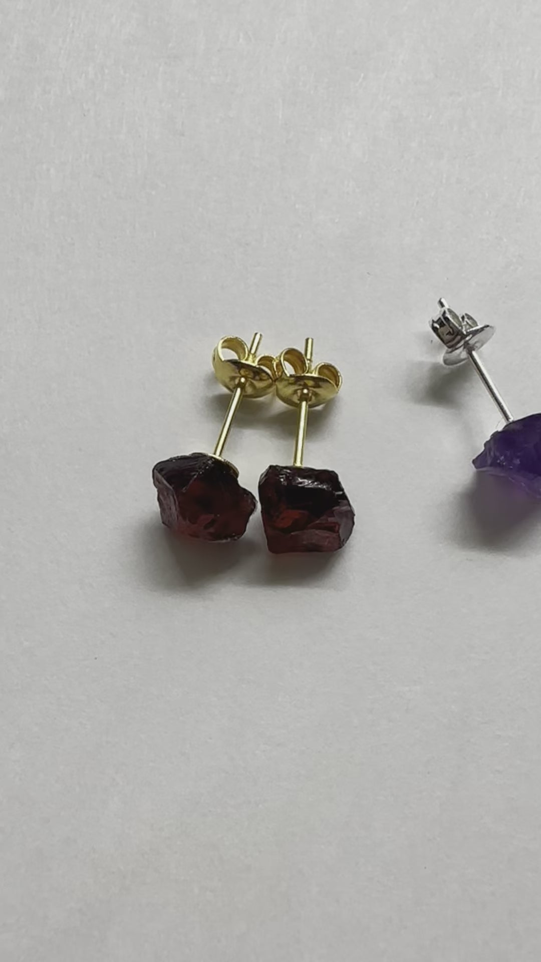 A real-time video showing all of the raw gemstone birthstone stud earrings.