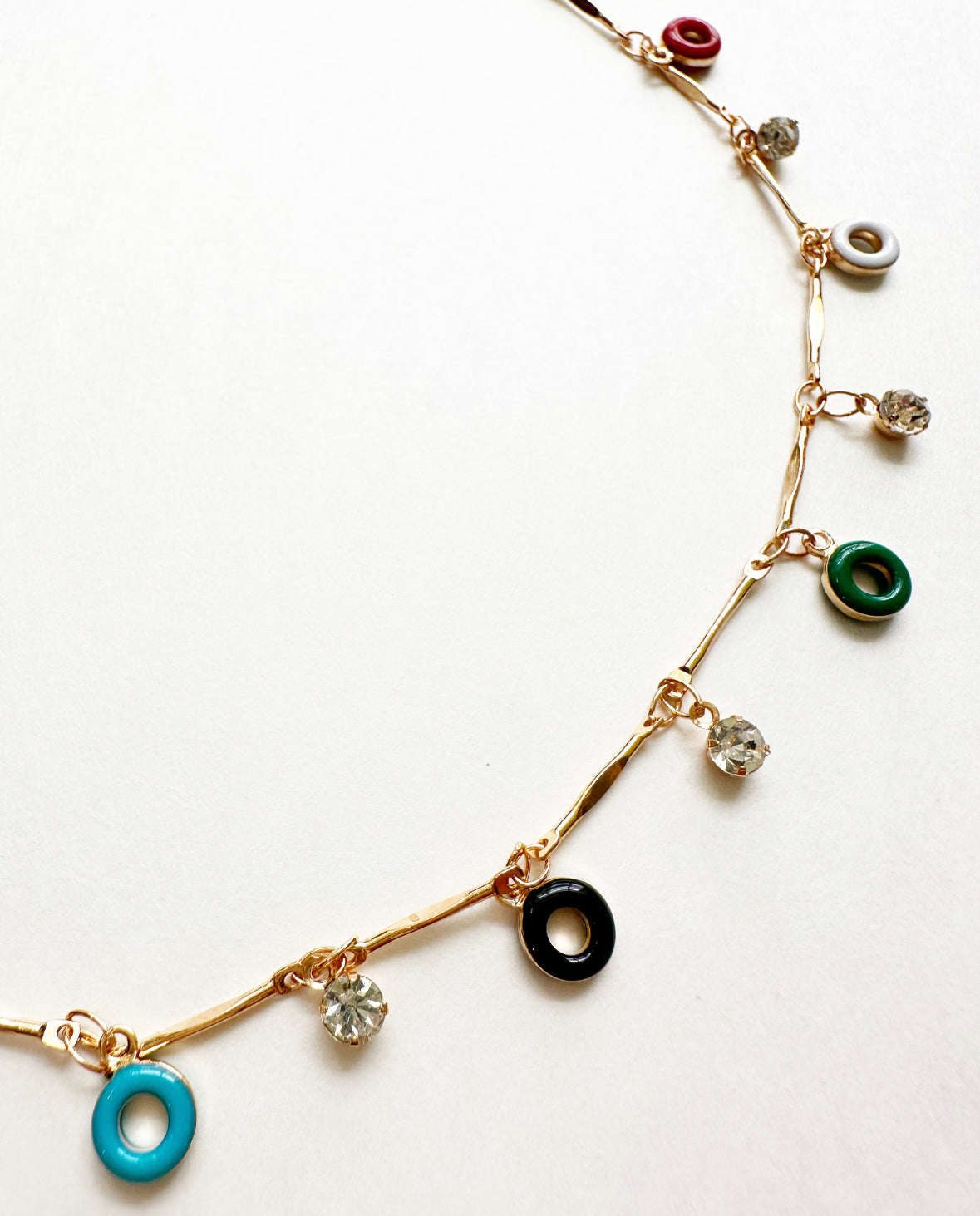 Close-up of rhinestone and charm details on Confection Choker Necklace.
