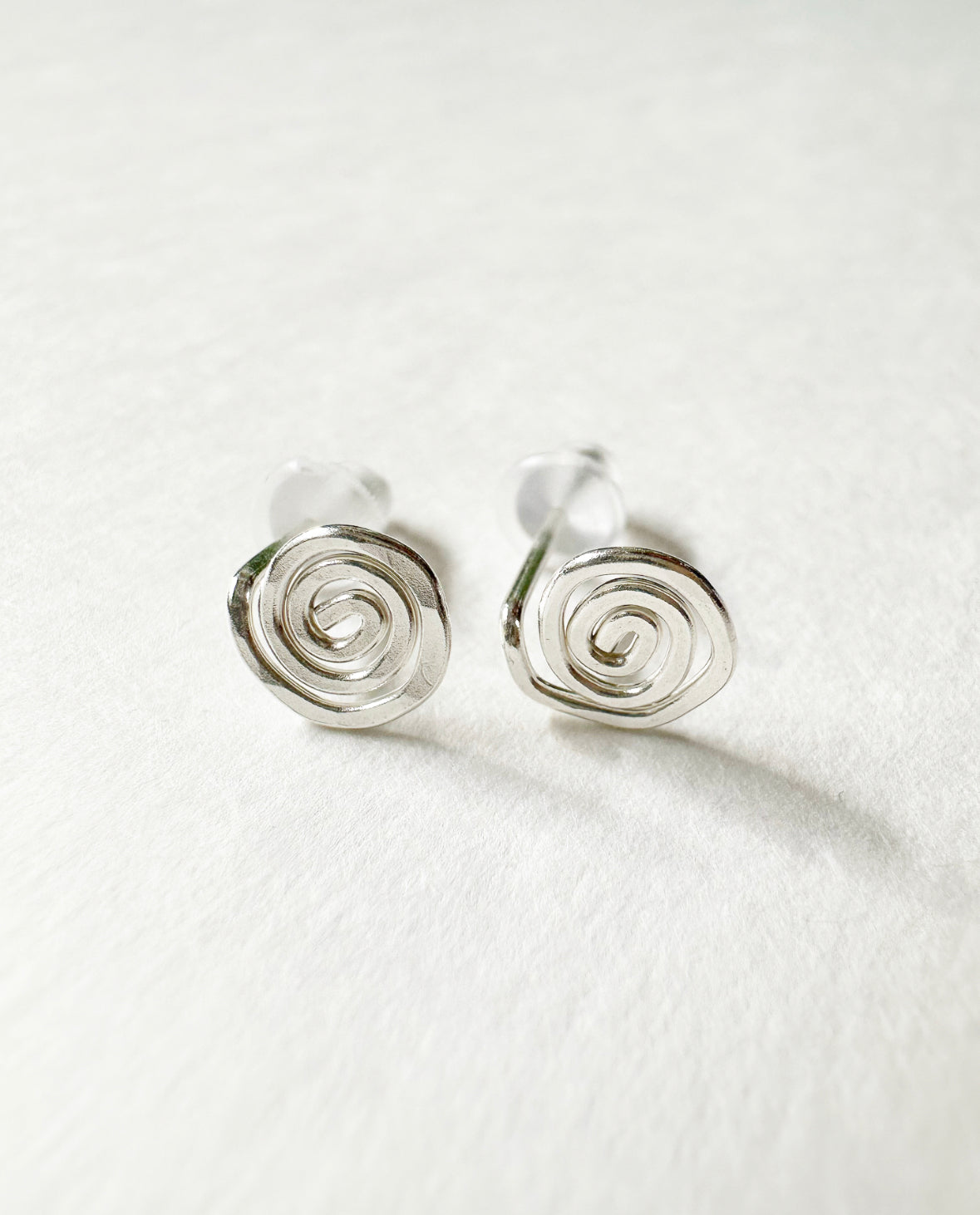 Close-up of 925 Sterling Silver Vortex Stud Earrings.