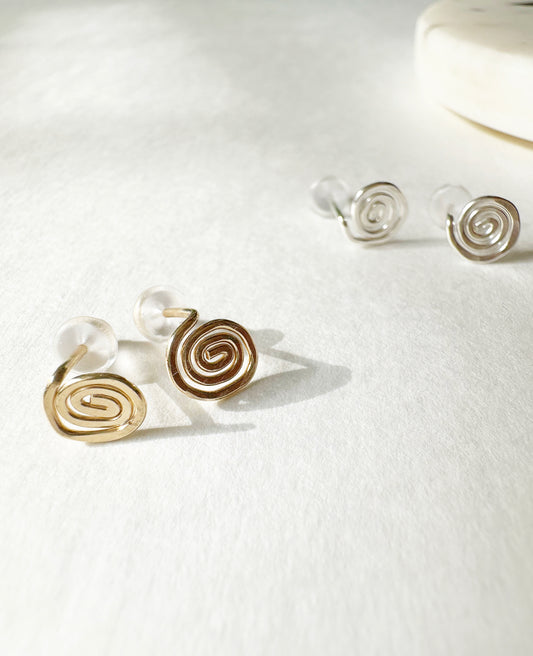 Gold and Silver Vortex Stud Earrings.